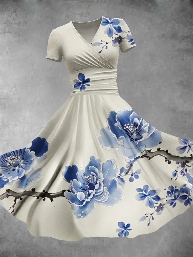 Robe mi-longue élégante rétro à manches courtes et col en V avec branches de fleurs bleues imprimées